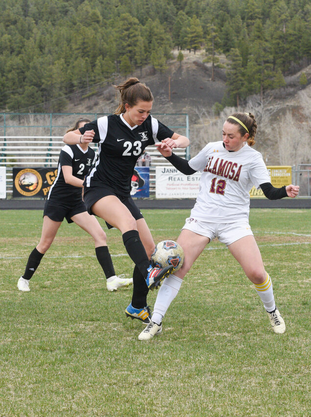 Lady Pirate Sophia Alexander works to maintain possession during a home game against Alamosa on April 5. The Pirates lost the match 7-0.