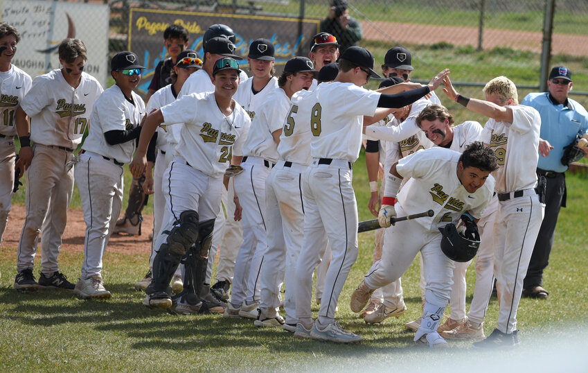 The Pirates celebrate after a home run off the bat of Kyler Henderson. Henderson’s homer followed a home run by teammate Hunter Pouyer.