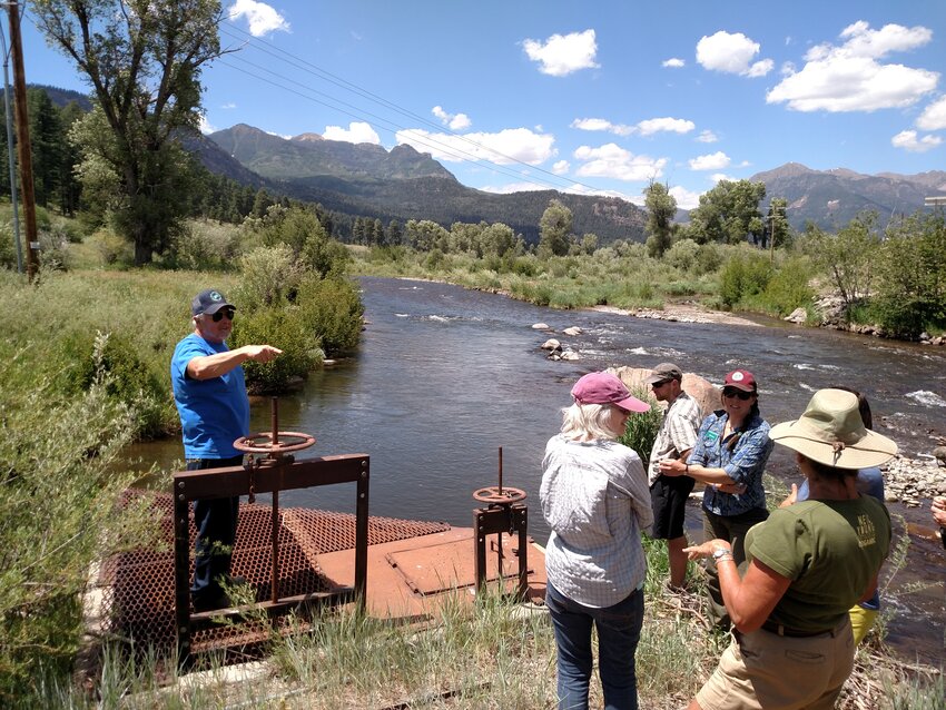 Art Holloman, water superintendent for the Pagosa Area Water and Sanitation District, shows the water intake on the San Juan River to previous Forests to Faucets participants. This year’s Forest to Faucets workshop for teachers will be held in Pagosa Springs.
