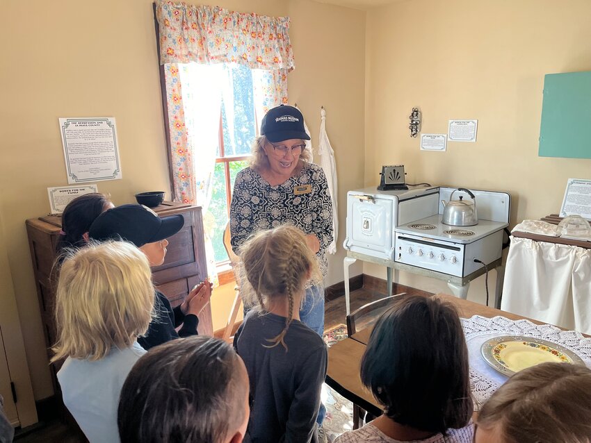 Second-graders at PPOS get a tour with Carolyn at the Animas Museum in Durango to learn more about what it meant to be a student in the past. Hazel said, “Life was a lot different back then. It was hard because you had the Great Depression. I am grateful I don’t have to walk to school in the morning after getting up and doing chores.”