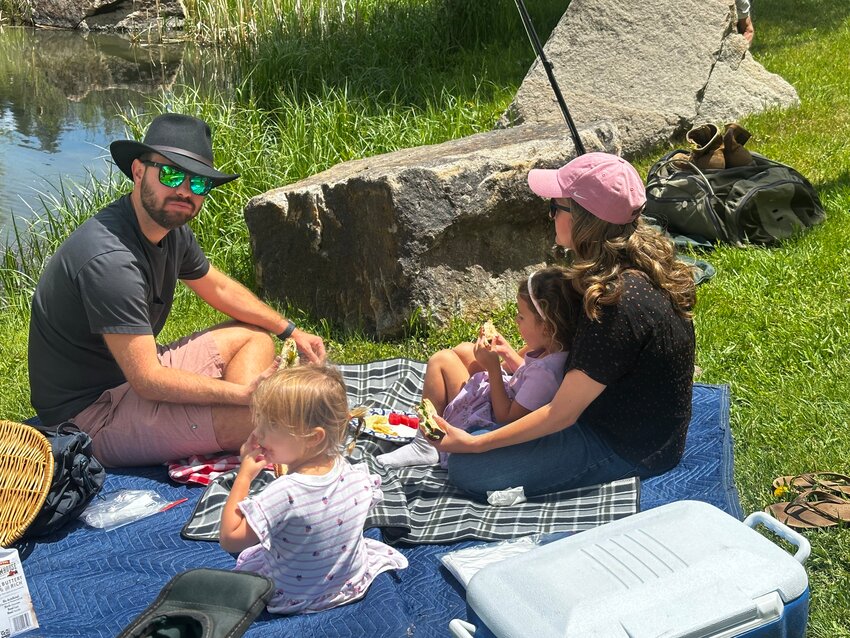 Scene ... Members of the Rotary Club of Pagosa Springs enjoy a day of fly fishing lessons, birdwatching and a picnic at River Center Park on June 5. Swapping meetings for mountain air, the group shared laughter, fellowship and a few casting tips.