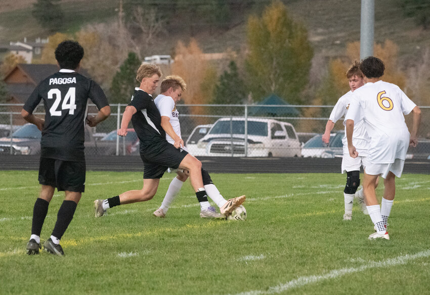 Pirate Ryder King battles to move the ball forward in the team&rsquo;s final home game against Bayfield on Thursday, Oct. 8. King scored one of the Pirates&rsquo; three goals in the win.