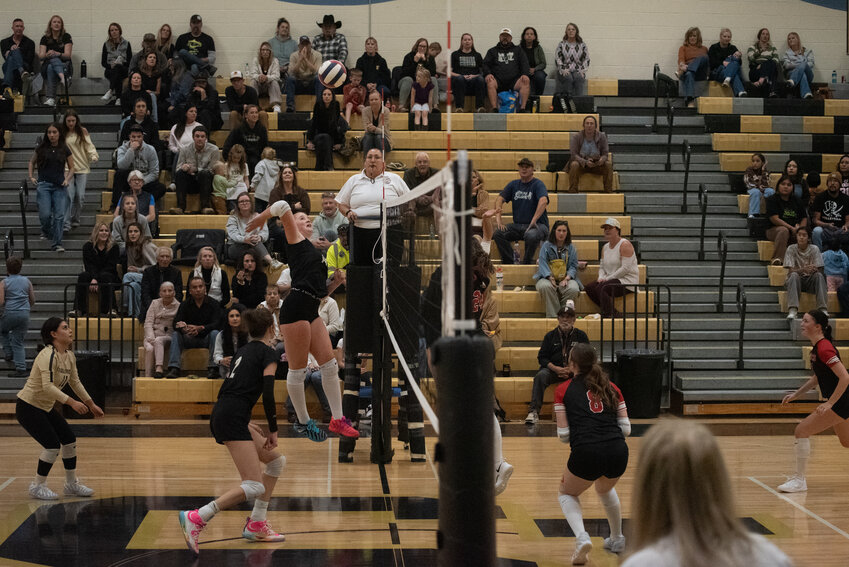 Lady Pirate Dawson Iverson sends the ball across the net as her fellow Pirates provide backup against the Ignacio Bobcats on Monday, Oct. 26.