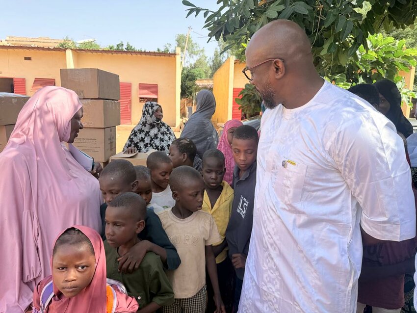 Rotary partners in Niamey, Niger, celebrate the arrival of educational supplies provided through a partnership with the Rotary Club of Pagosa Springs. The project includes Braille writing machines, specialized paper and LEGO Braille Bricks to support students who are blind or visually impaired.