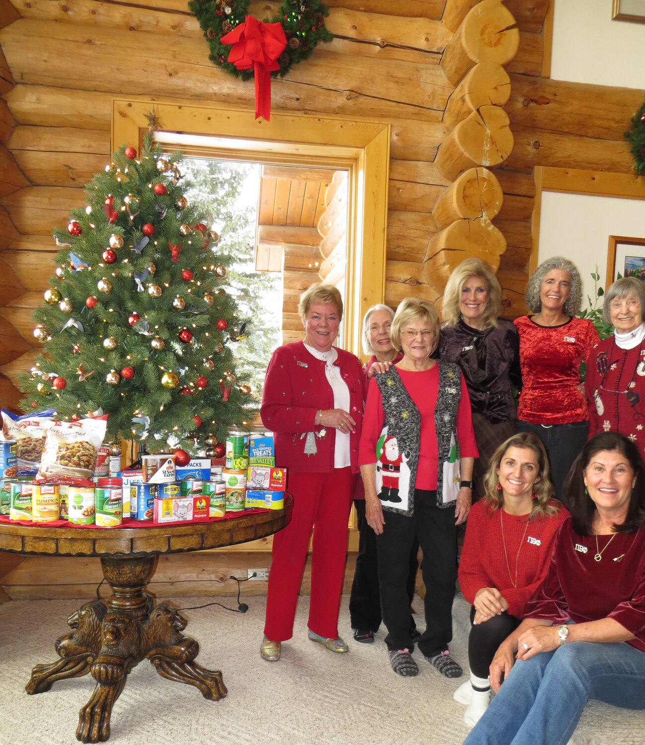 Local Pi Beta Phi sorority alumnae gathered at the home of Carole Howard on Dec. 1 for their annual Christmas angel potluck luncheon. Posing with a tiny fraction of the 200 pounds of food they donated to Healthy Archuleta’s food distribution center for community food banks are, standing left to right: Carole Howard, Mary Rothchild, Melissa McDonald, Paula Tennant, Ann Bubb and Mary Bailly. Seated, left to right, are Kelly Maestas and Lisa Scott. The ladies also donated toiletries to Rise Above Violence, a local social service organization supporting domestic violence victims. The festive holiday event also included an angel gift exchange. Pi Beta Phi, founded in 1867, is the oldest national sorority in the U.S. Today there are 135 collegiate chapters in the U.S. and nearly 300 alumnae clubs around the world.