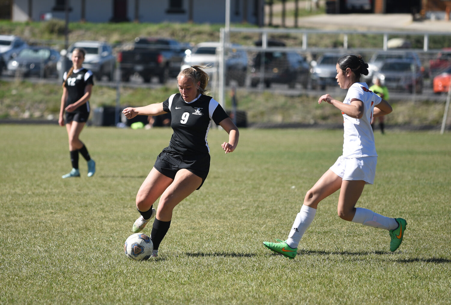 Lady Pirate senior Taylor Elliott sends the ball up the field during a game against the Del Norte Tigers on April 30. Elliott scored one goal in the match, which was her final home game for the team.