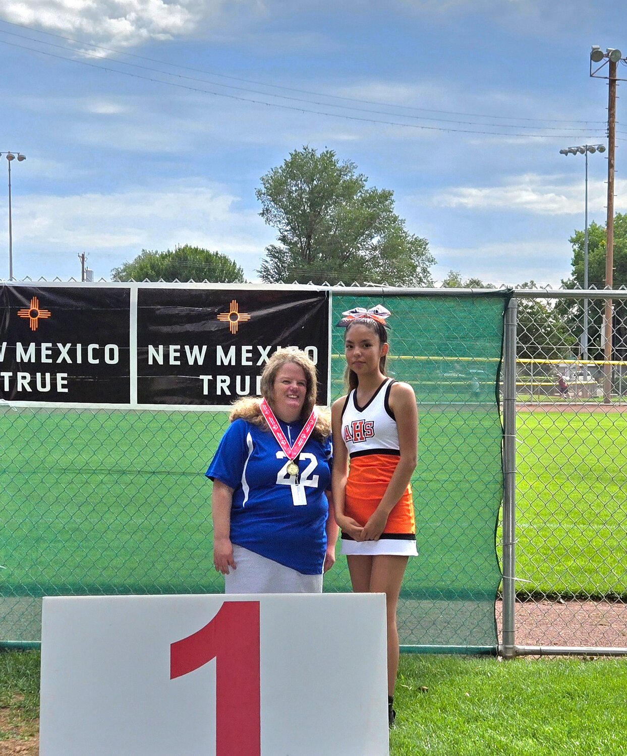 Meredith Irons stands with the gold medal she earned in the softball skills event at the Special Olympics New Mexico Four Corners Invitational softball tournament in Farmington, N.M., on Saturday, Aug. 24.