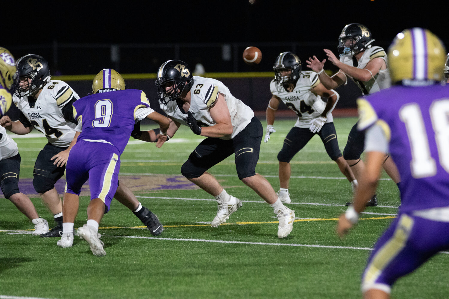 Pirate Seth Zeigler takes a snap for the Pirates’ offense during their game against Kirtland Central.