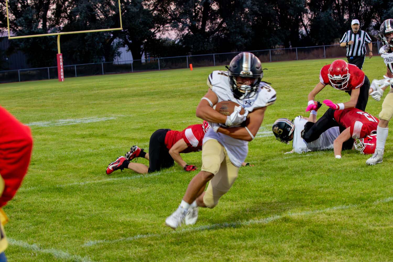 Colton Lucero breaks away from Centauri defenders during the Pirates game against the Falcons on Sept. 6. Lucero led the Pirates in rushing on the night with a total of 226 yards and two touchdowns.