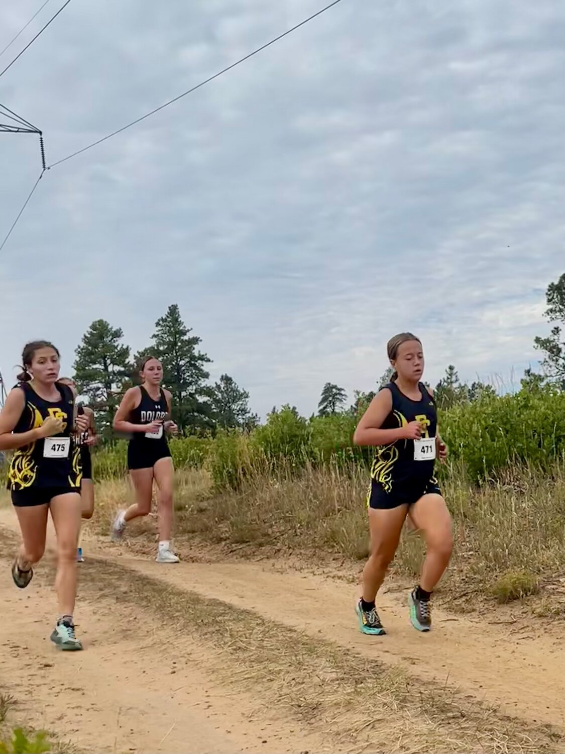 Madisen Stretton and Adison Johnson run together at the Boggy Draw Bear Chase on Sept. 20. Stretton finished 18th and Johnson finished 13th at the meet.