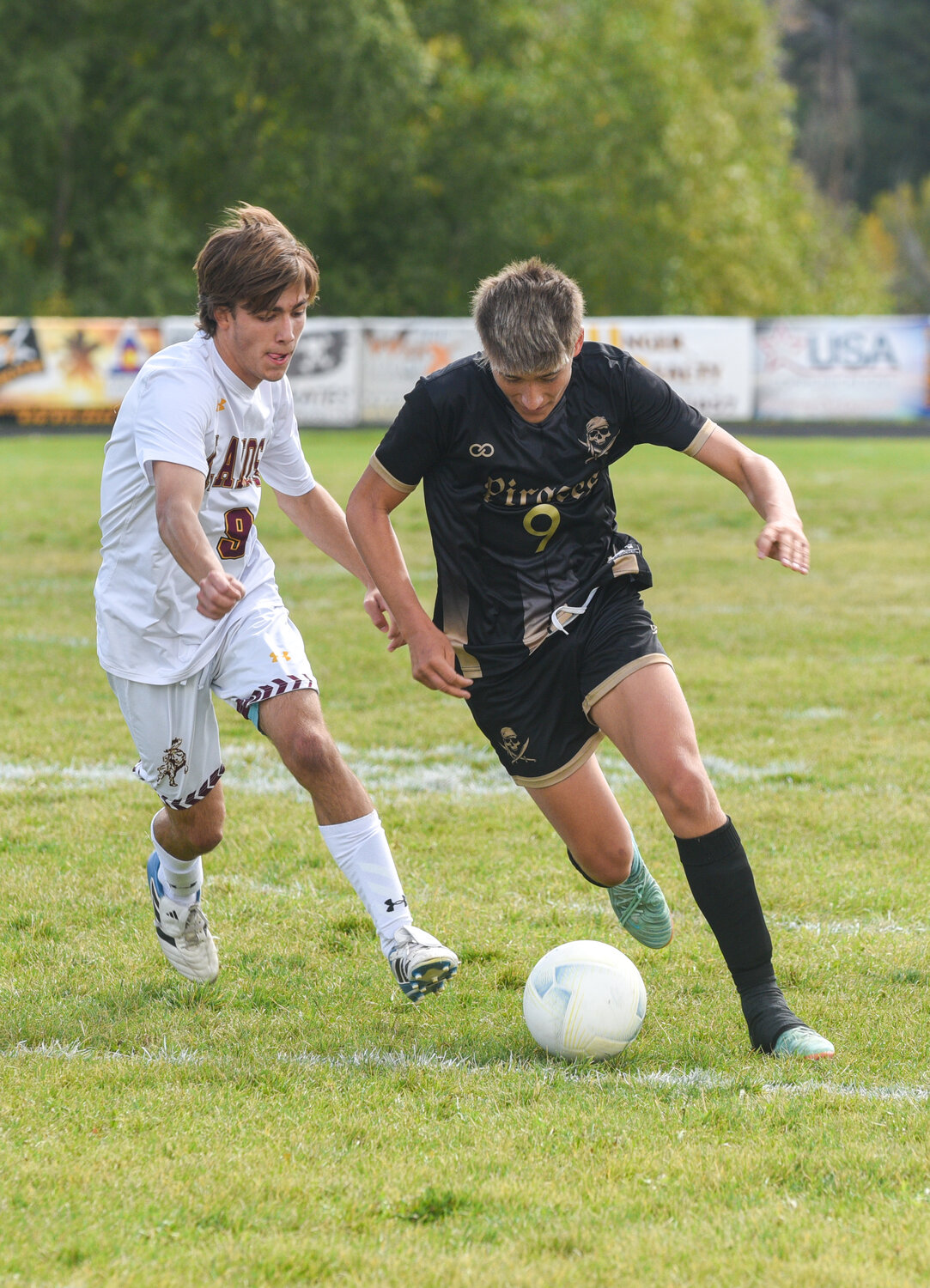 Chance Ramirez outruns an Alamosa defender with the ball during the Pirates’ match against the Mean Moose on Sept. 21.