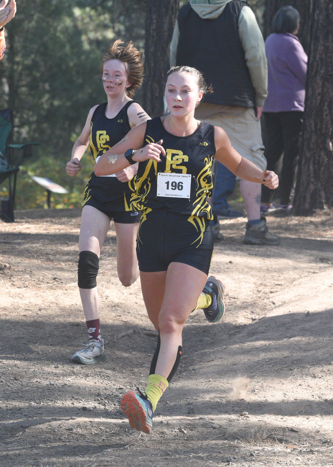 Lady Pirates Sienna Rose and Kaiya Lyons eye the finish line at Saturday’s meet atop Reservoir Hill. The pair finished within a fraction of a second of each other and were named to the all-conference second team.