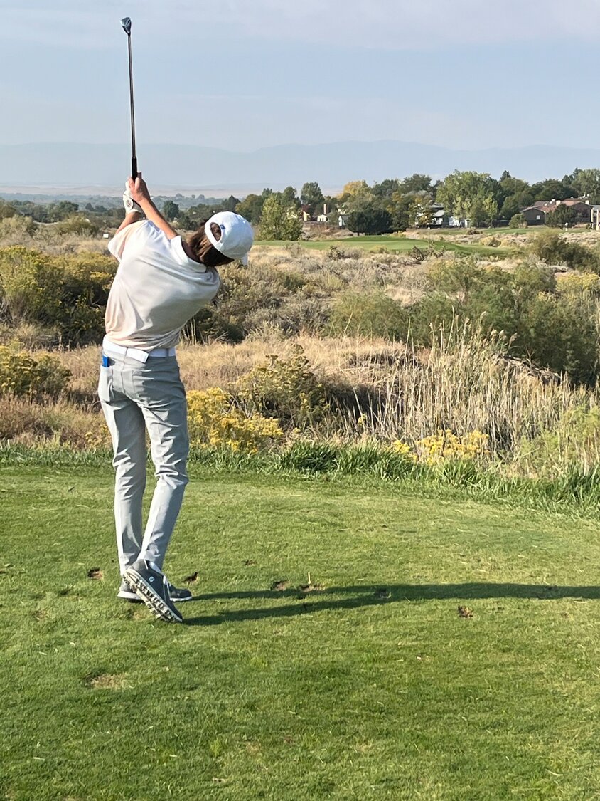 Pirate Tyler Dimond watches a shot during the 3A state golf tournament that took place Monday and Tuesday in Pueblo. The freshman tied for 72nd at the event.