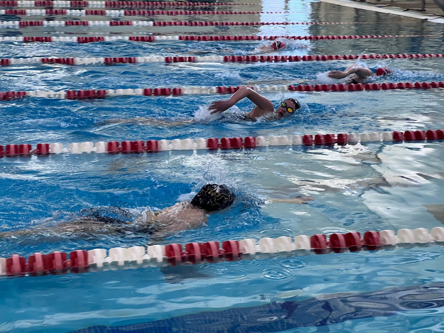 Leah Blackman, near, and Gianna Shaeffer, far, swim in Durango last week. The team took part in two meets in Durango last week, with several Lady Pirates dropping times.