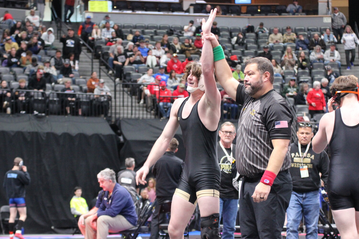 Taylor Hancey gets his hand raised after defeating his opponent in the opening round of the 165-pound weight class at last week&rsquo;s state tournament.