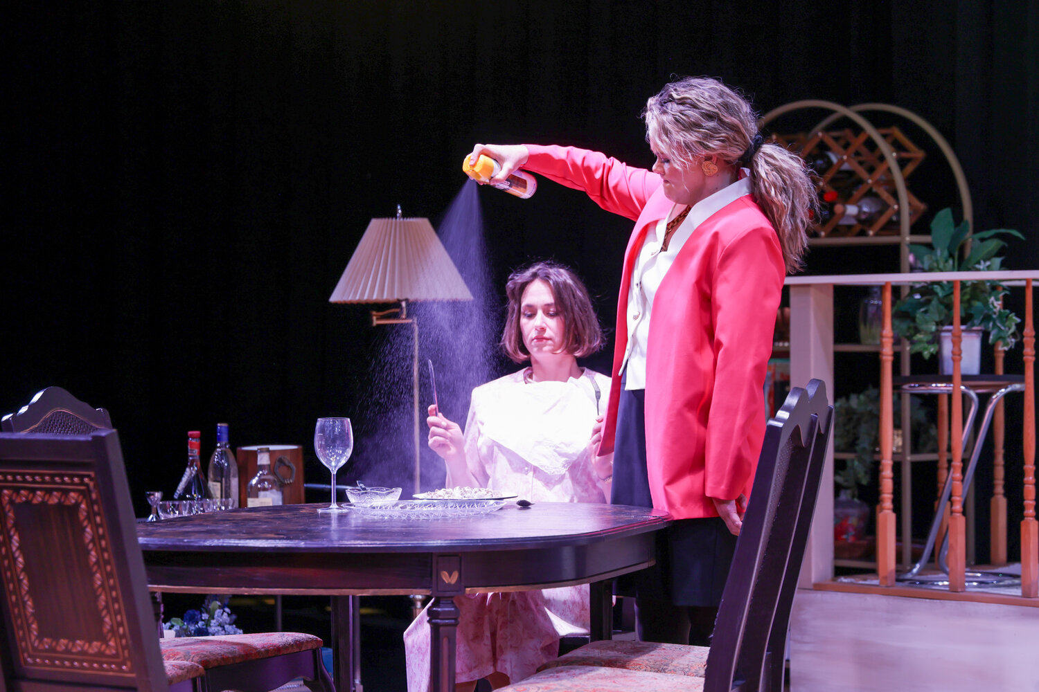 Olive Madison (played by Ivy King) loses her patience and douses Florence Unger’s (Karisa Bruin) linguini with Pledge in a heated moment of frustration during “The Odd Couple (Female Version)” at Pagosa Springs Center for the Arts.