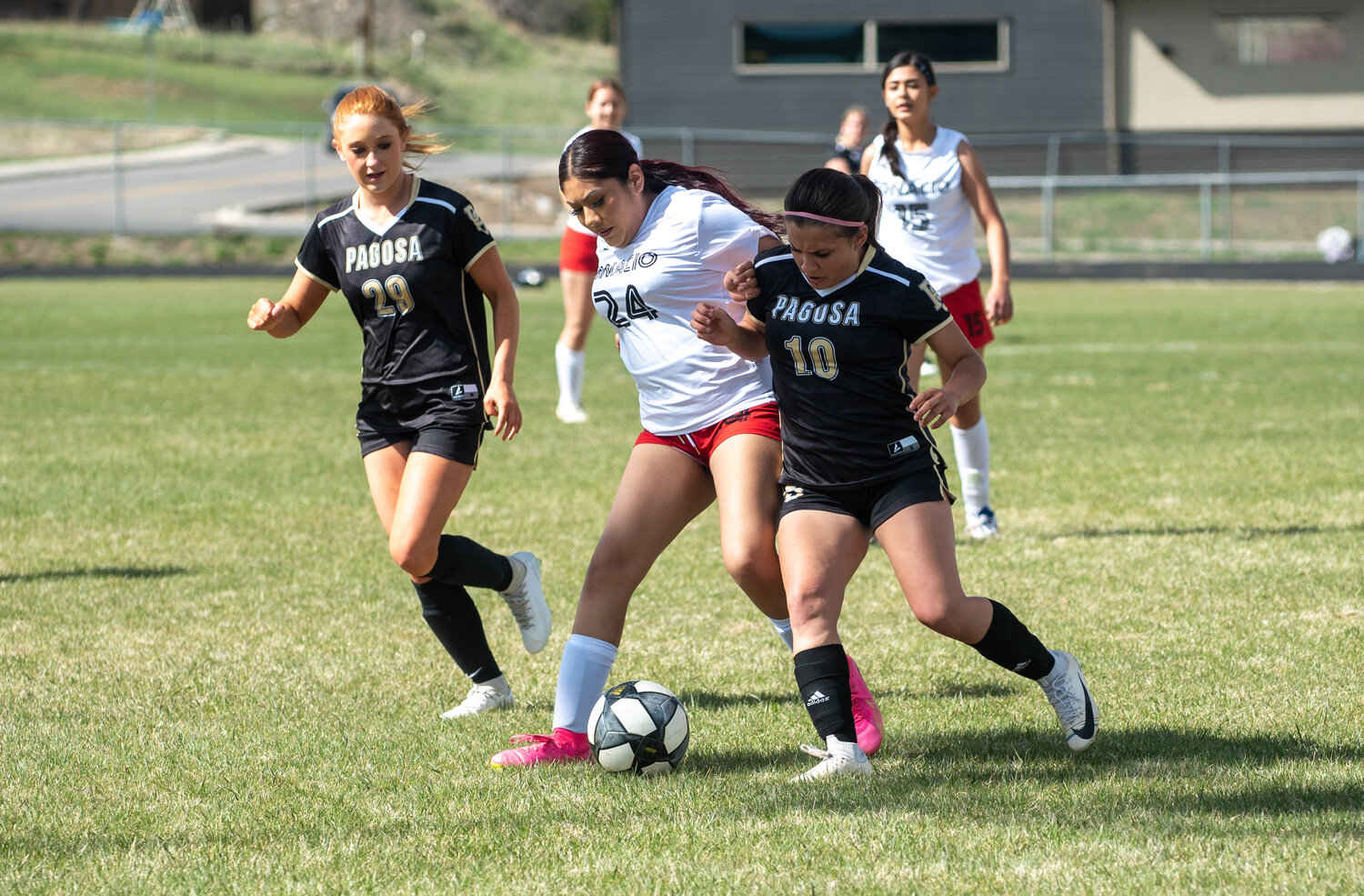 Tatiana Monterroso battles with an Ignacio Bobcat to gain control of the ball during the teams’ matchup on Tuesday, April 22. Monterroso scored four goals to help the Lady Pirates win 10-0.