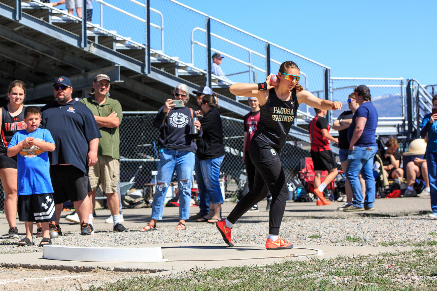 Abigail Nehring prepares to launch a shot at the Pine River Invitational on April 26 in Bayfield. Nehring finished first in both the shot put and discus at the meet.