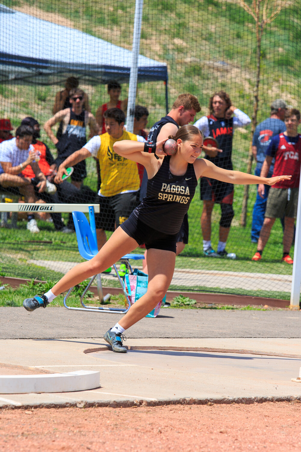 Lady Pirate Liana Vega throws the shot during the shot put at the May 9 Friday Night Lights meet in Pueblo. Vega took 10th with a distance of 97 feet, 5 inches.