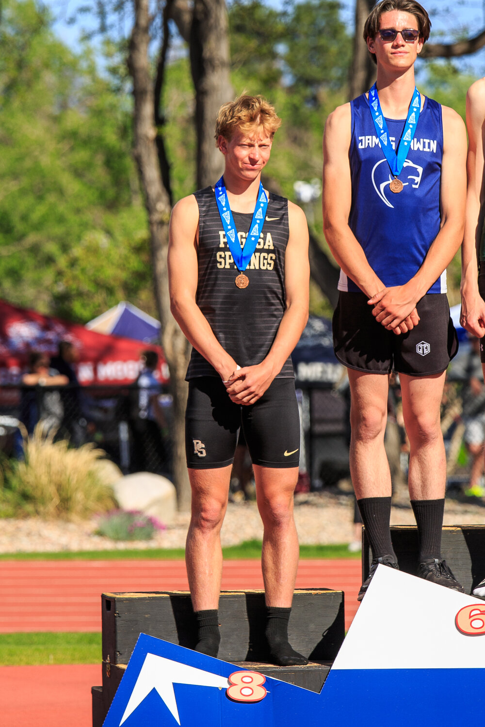 Photo courtesy Jessica Carr
Jeremiah Jones stands on the podium after finishing eighth in the boys’ high jump.