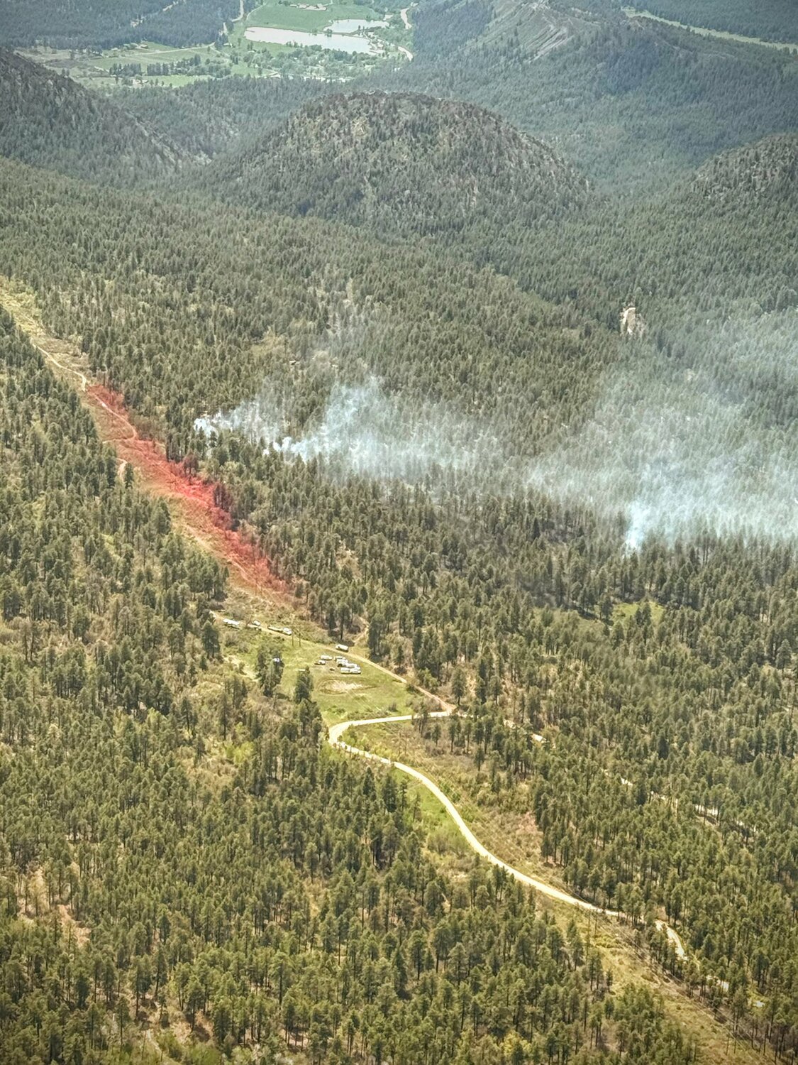 The Freeman Fire, located in the First Notch area, puts up smoke on May 25 near a power transmission line that feeds Archuleta County. Firefighters took an &ldquo;aggressive firefighting tactic&rdquo; due to the values at risk.