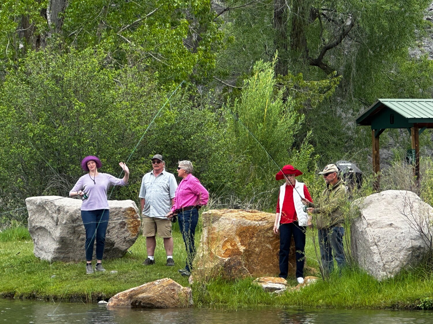 Scene ... Members of the Rotary Club of Pagosa Springs enjoy a day of fly fishing lessons, birdwatching and a picnic at River Center Park on June 5. Swapping meetings for mountain air, the group shared laughter, fellowship and a few casting tips.