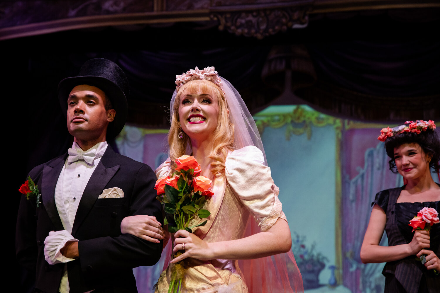 André Spathelf-Sanders (groom) and Cassandra Brooks (Sibella) share the altar in “A Gentleman’s Guide to Love and Murder,” while wedding attendant Catie Leonard looks on. For tickets and show information on the three shows in rotation at the Pagosa Springs Center for the Arts, visit pagosacenter.org or call (970) 731-SHOW (7469).