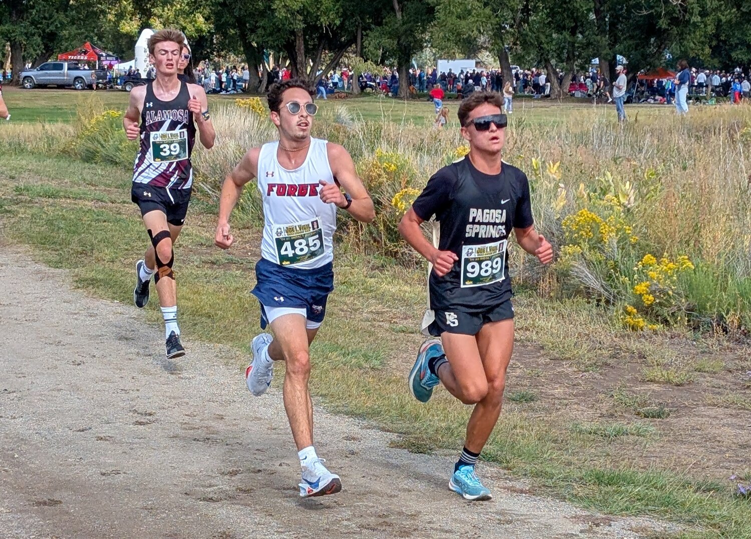Rylan Ash runs alongside competition at Saturday&rsquo;s Joe I. Vigil meet in Alamosa. Ash took 55th out of 403 runners on the day with a time of 17 minutes, 17.37 seconds.