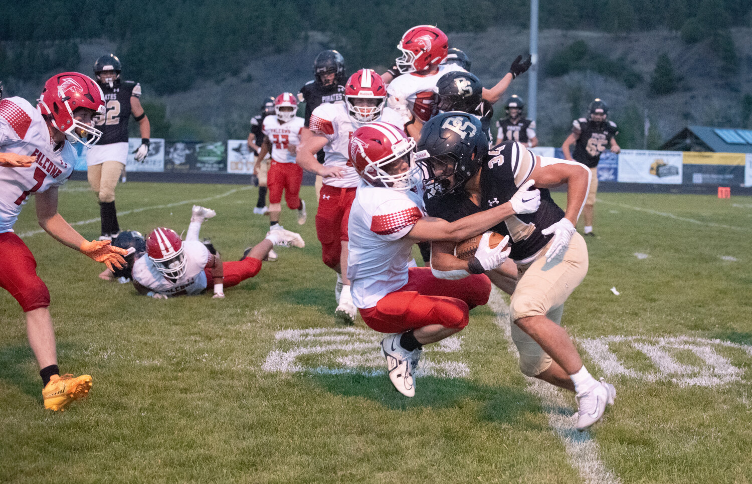 Pirate running back Colton Lucero runs over a Centauri tackler Thursday night. The Pirates were handed their first loss of the season, falling to the Falcons 42-7.