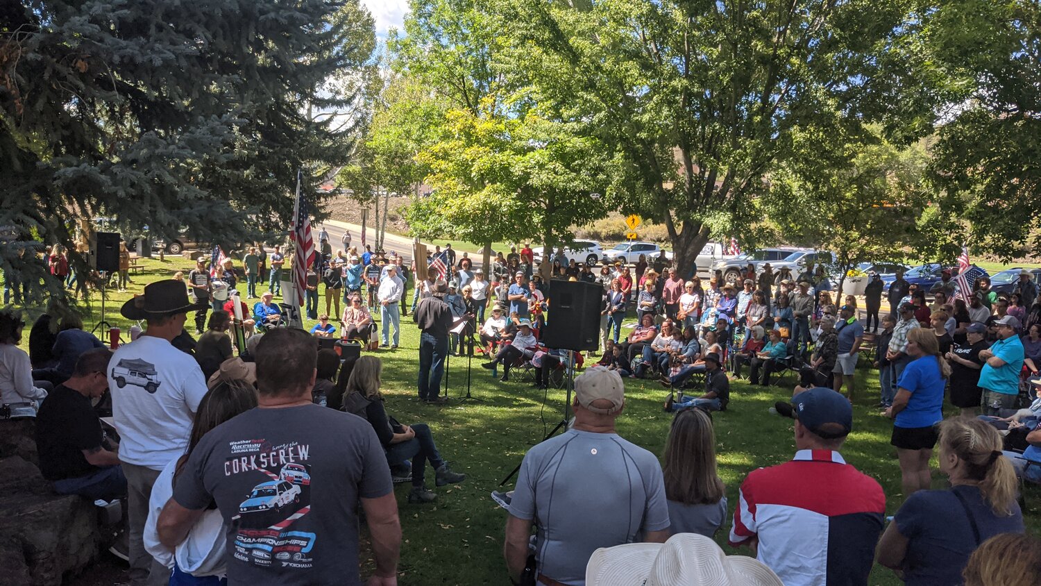 A crowd gathers at Town Park the afternoon of Sunday, Sept. 14, holding a prayer vigil and tribute for Charlie Kirk, the conservative activist who was killed on Sept. 10 while speaking at a college campus in Utah. The vigil and tribute included numerous people speaking, prayers, poems and songs in honor of Kirk.