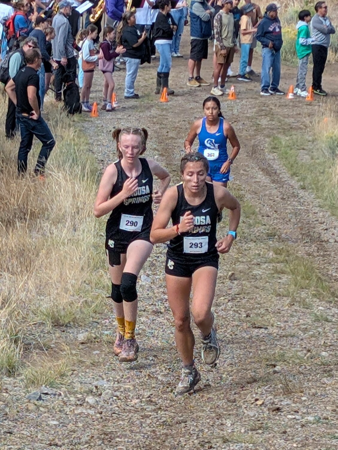Lady Pirates Madi Stretton, front, and Kaiya Lyons climb a hill at the Sept. 13 Bayfield XC Invitational. Lyons took 17th on the day, followed by Stretton in 18th.