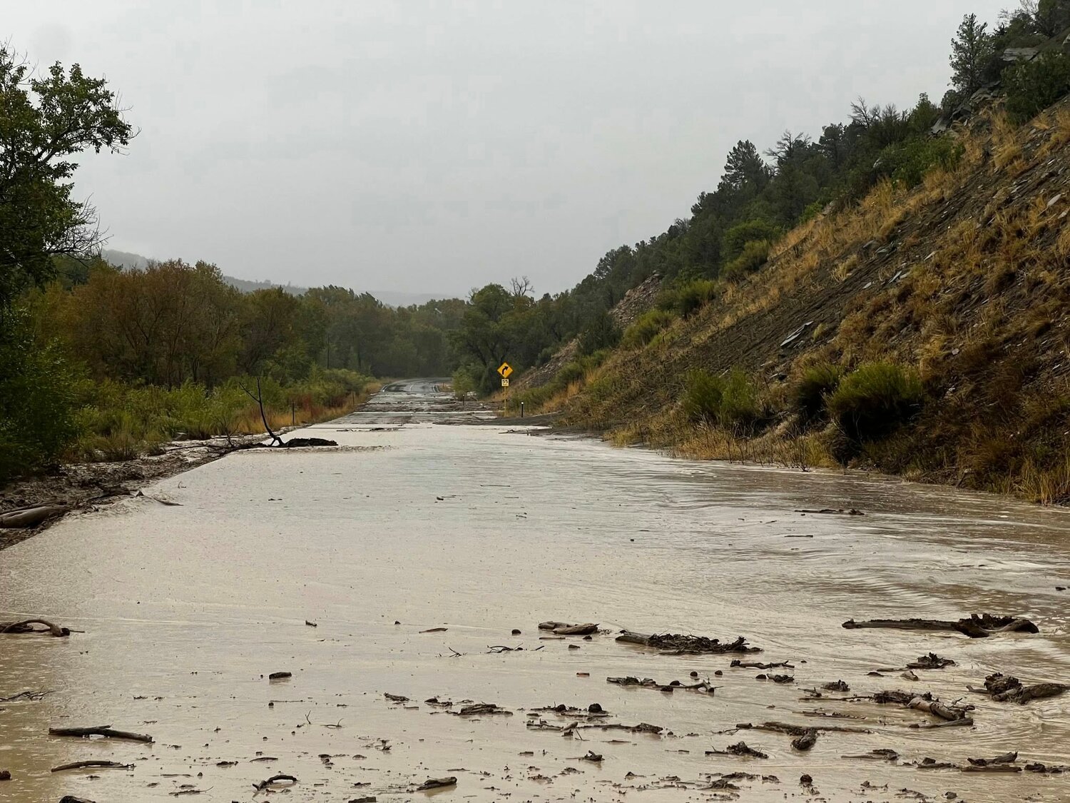 Flooding takes place on Colo. 151 Friday, Sept. 12. Areas of Archuleta County received upwards of 2 inches of rain last week, leaving parts of the county experiencing flooding and mudslides. According to the Colorado Department of Transportation, Colo. 151 between U.S. 160 and Arboles was closed for approximately 3.5 hours on Sept. 12 while maintenance crews responded with two snow plows and a loader to clear the road after flash flooding. Archuleta County reported flooding and mudslide issues from the Carracas area to Colo. 151.
The rain also boosted area rivers. The San Juan River in Pagosa Springs jumped to 1,010 cubic feet per second (cfs) on Sept. 13, up from 24.2 cfs on Sept. 10. The Piedra River near Arboles jumped to 540 cfs on Sept. 13, up from 19.4 cfs. As of 11 a.m. on Wednesday, Sept. 17, the river was running at 95.6 cfs. As of 11:15 a.m. on Sept. 17, the site recorded a flow of 103 cfs.
As of Wednesday morning, Sept. 17, sites around Archuleta Country reported between 1.87 inches (between downtown and uptown Pagosa Springs) and 3.68 inches (east of Chromo) received so far in September, besting the month’s average of about 2 inches.
According to Pagosa Weather, through Friday, “there will be lots of blue sky and pleasant temps.”
