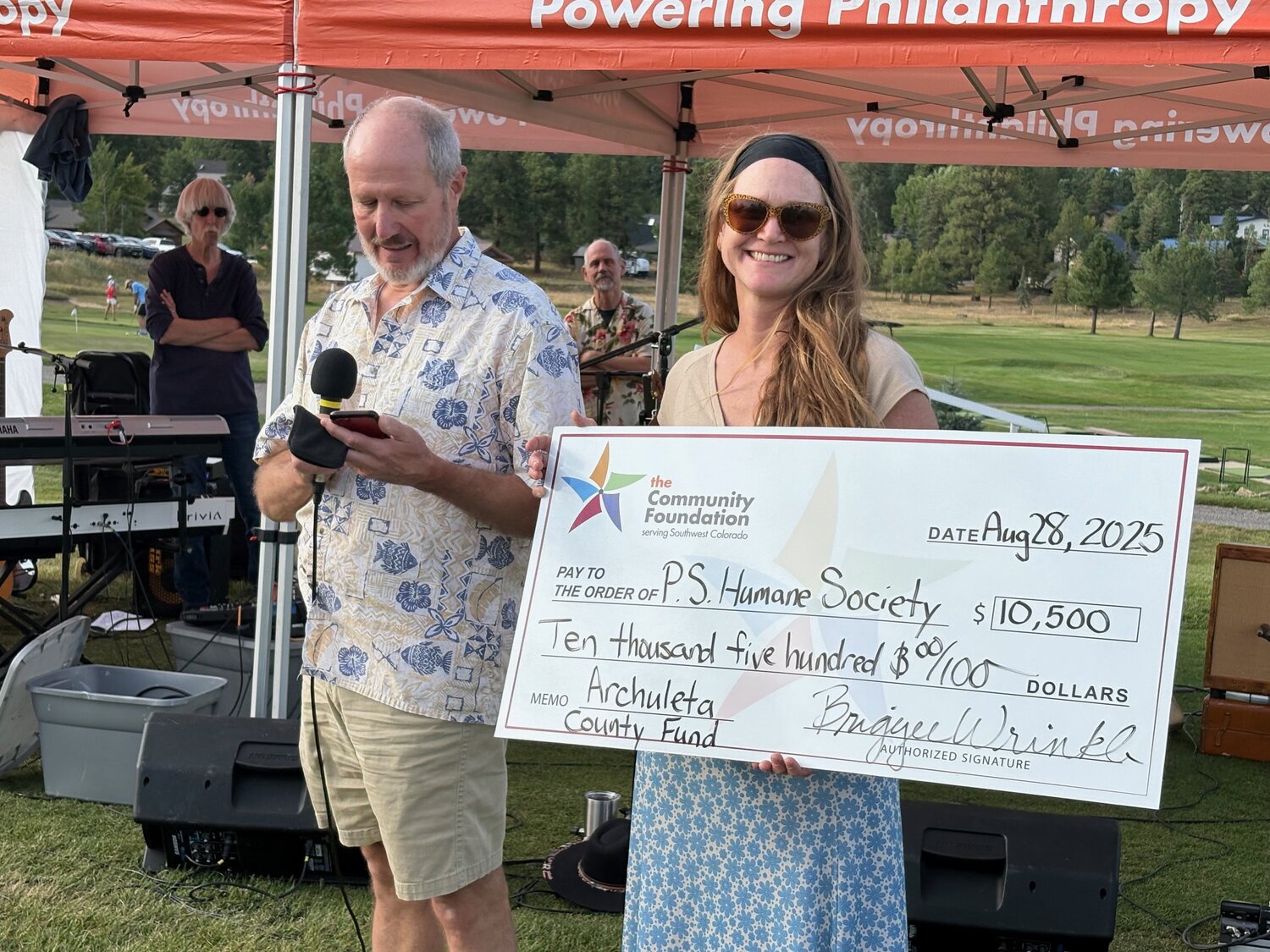 The Humane Society of Pagosa Springs receives a grant for the Archuleta County Fund at the recent Labor Day Kickoff Concert.