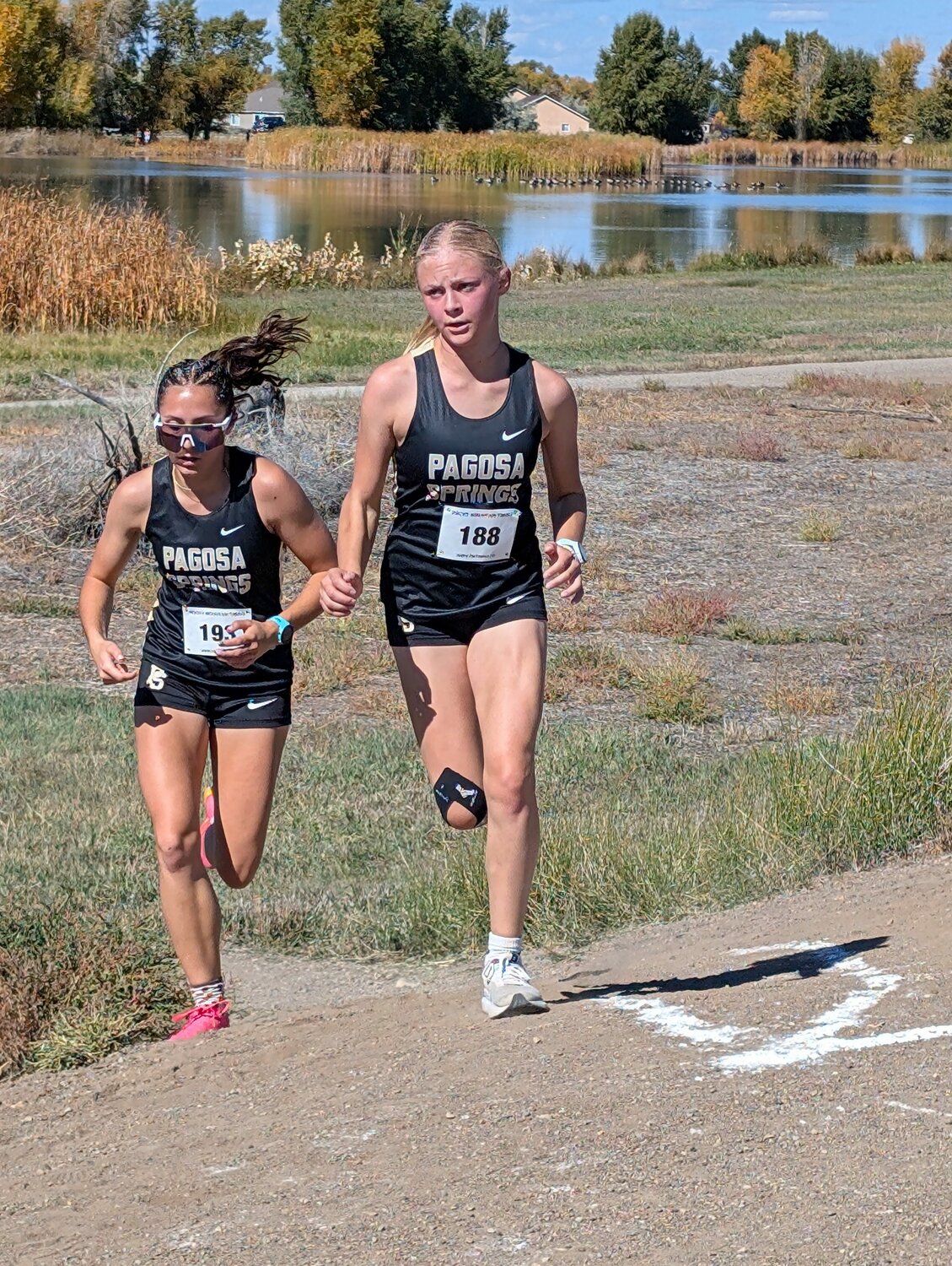Lady Pirates Lily DeClark and Madisen Stretton run at the Zargoza/Intermountain League Meet in Alamosa on Friday, Oct. 3. Both Lady Pirates earned all-conference honors with their finishes on the day.
