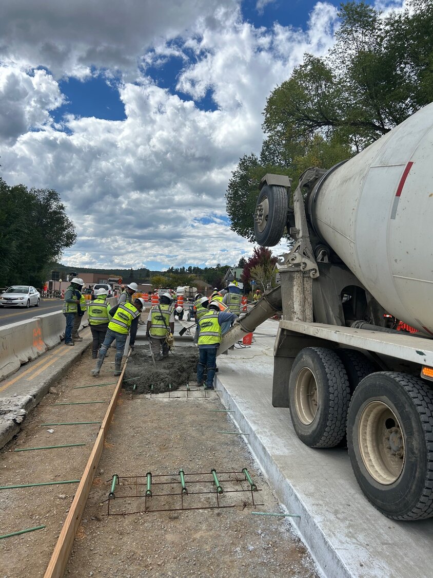 Hand pouring of concrete continues. Once the roadway flat work is completed, crews prepare for curb, gutter and then sidewalks.