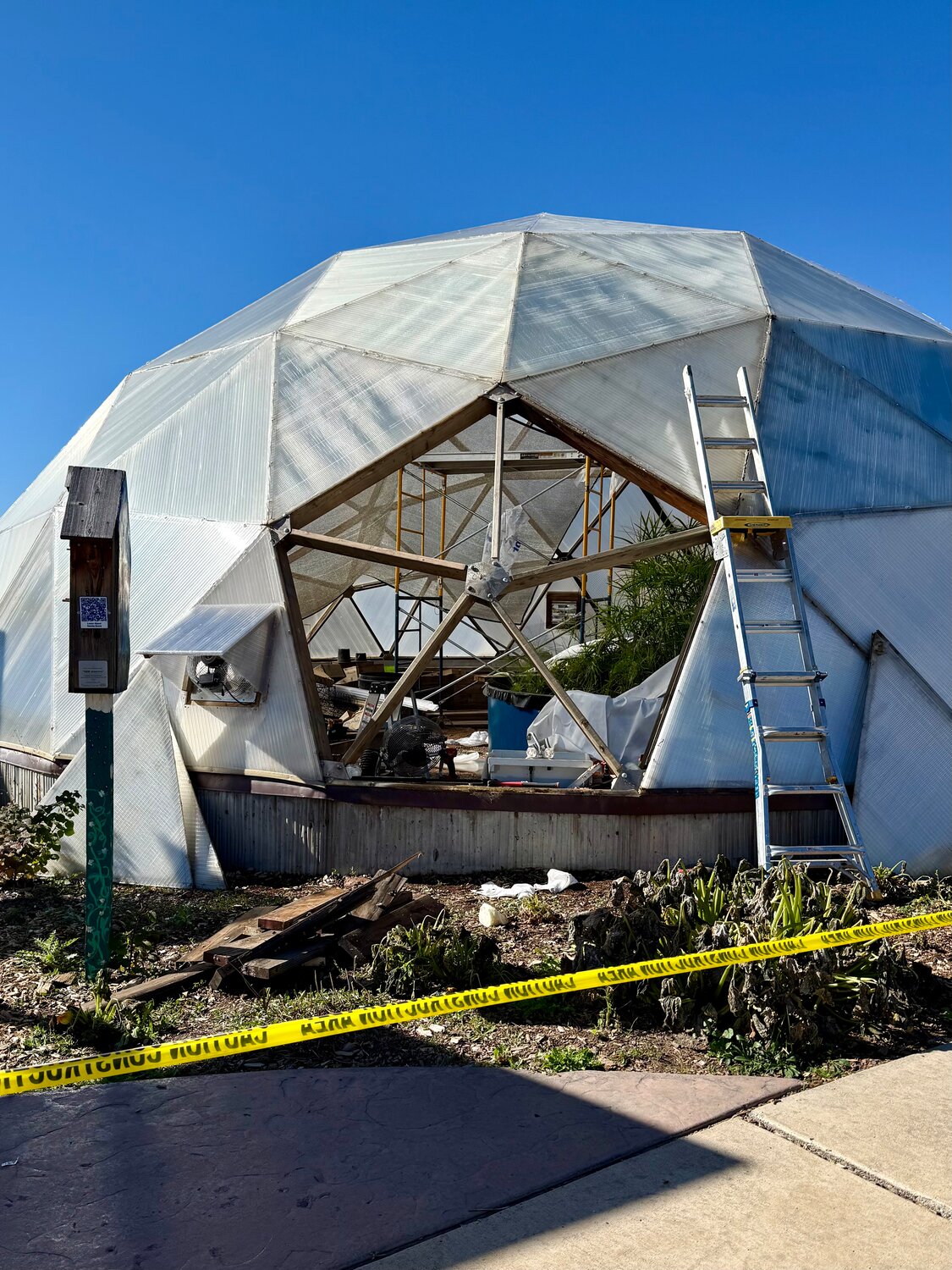 Maintenance work continues at the Geothermal Greenhouse Partnership growing domes in Centennial Park.