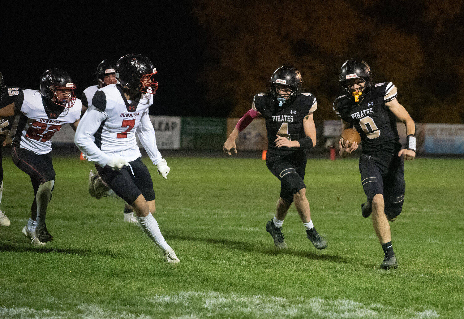 Hudson Mazur gains the corner on a Gunnison defender rushing for a 33-yard touchdown, contributing to the Pirates&rsquo; 49-14 win over the Cowboys on Friday, Oct. 17, at Golden Peaks Stadium.