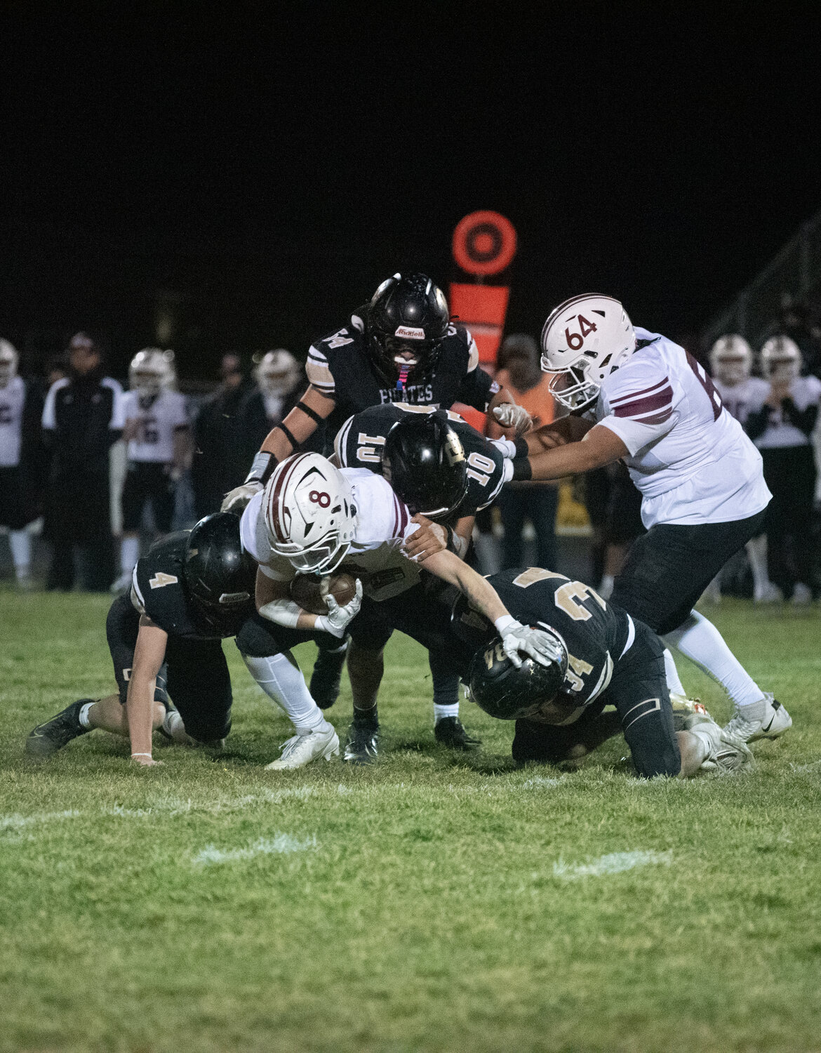 A gang of Pirates swarm to take down an Alamosa ball carrier. Pagosa Springs defeated Alamosa on Friday, Oct. 31, by a score of 24-21, claiming the Intermountain League title.