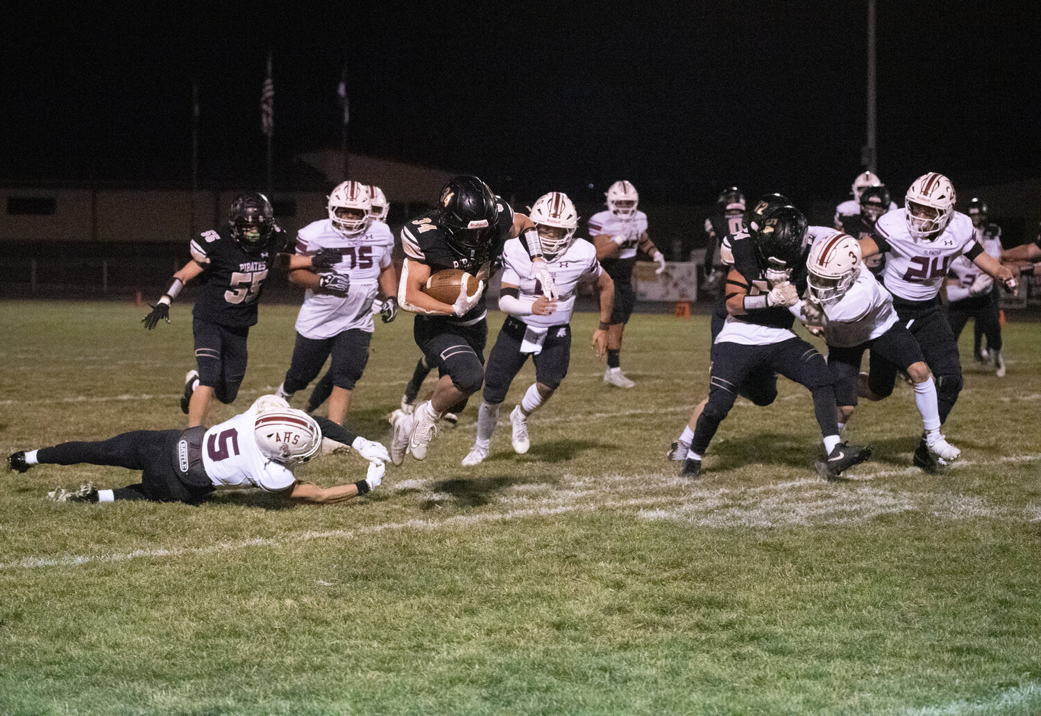 Pirate running back Colton Lucero makes an Alamosa defender miss while rushing the ball in the team&rsquo;s matchup on Friday, Oct. 31. Lucero led the Pirates with 175 rushing yards and one touchdown on the night.