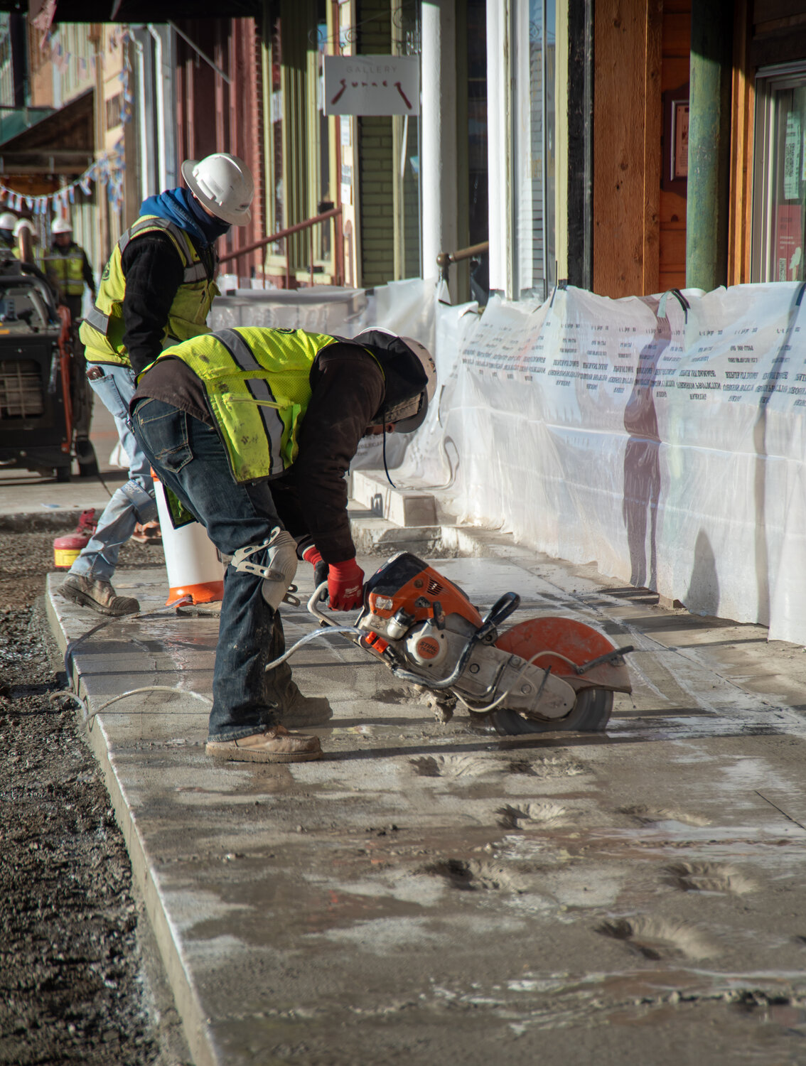 U.S. 160 reconstruction personnel work prepping newly poured concrete for removal Wednesday morning after someone entered the work zone the night before and damaged the concrete.