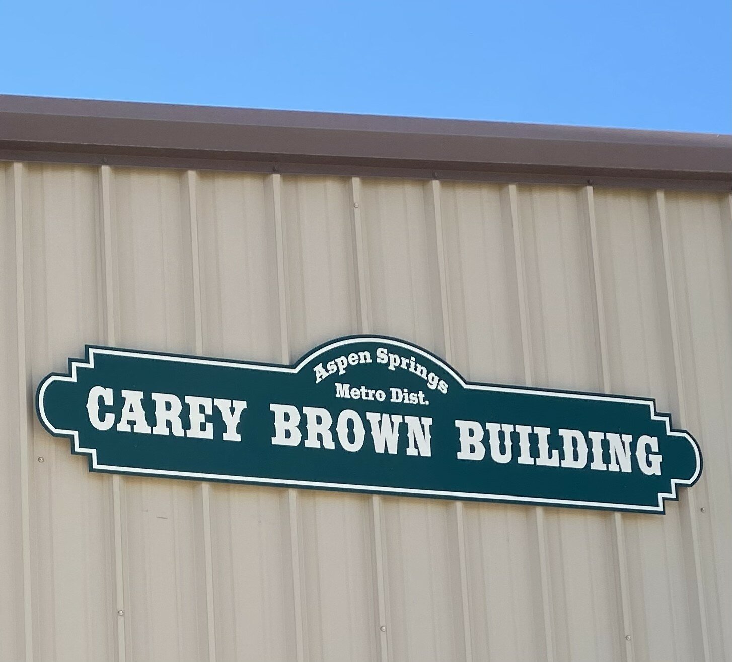 The Aspen Springs Metro District&rsquo;s building sports a new sign in honor of Carey Brown, who recently stepped down from the district&rsquo;s public works manager role. He helped build the roads beginning in 1982 and has been working full-time on the district&rsquo;s roads since 1984. Brown hasn&rsquo;t left the district completely, however; he continues to work part-time, including mentoring the district&rsquo;s new public works manager, Ryan Keifer.