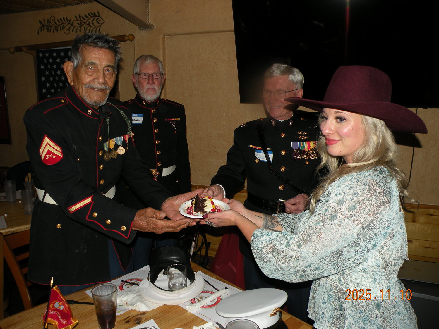 Archuleta County Marines and their guests gather on Nov. 10 to celebrate the 250th birthday of the U.S. Marine Corps. In tradition, the oldest Marine in attendance, Ernie Garcia, presented the first piece of cake to the youngest Marine, Amber Bonner, as a symbol of passing the traditions, legends and responsibilities from the old Corps to the new Corps. Garcia, who entered the Marine Corps in 1953, was born in 1935. Bonner entered the Corps in 2019 and was born in 2002.