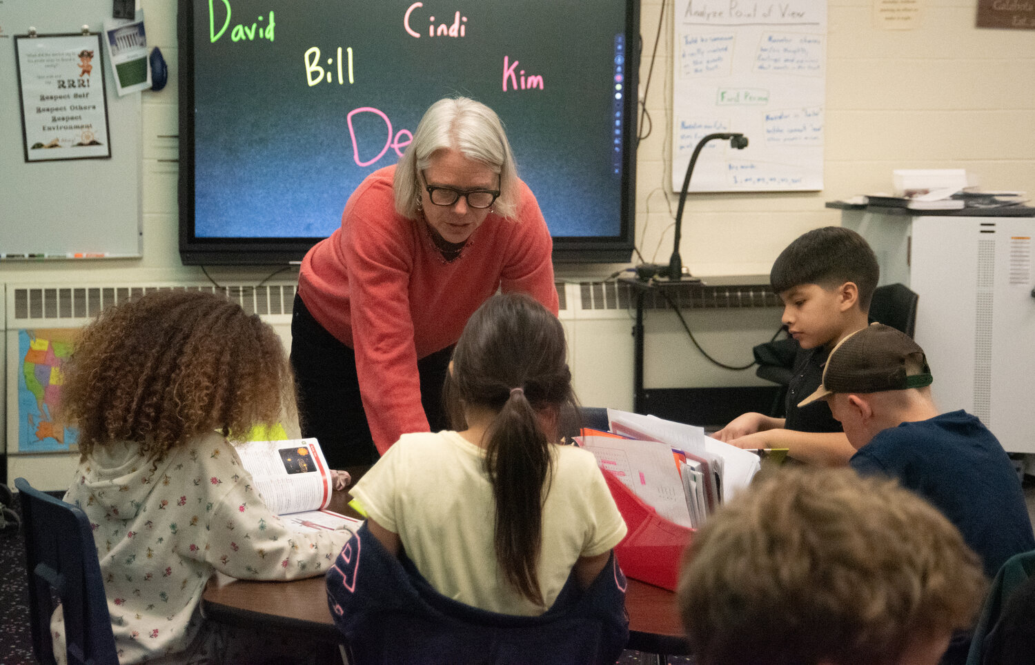 Local Rotarians hand out more than 100 dictionaries to Pagosa Springs Elementary School third-graders and dive into the new books together. Rotarians encouraged the children to look up various words and to explore other sections of the book, such as state and country flags, maps and presidents.