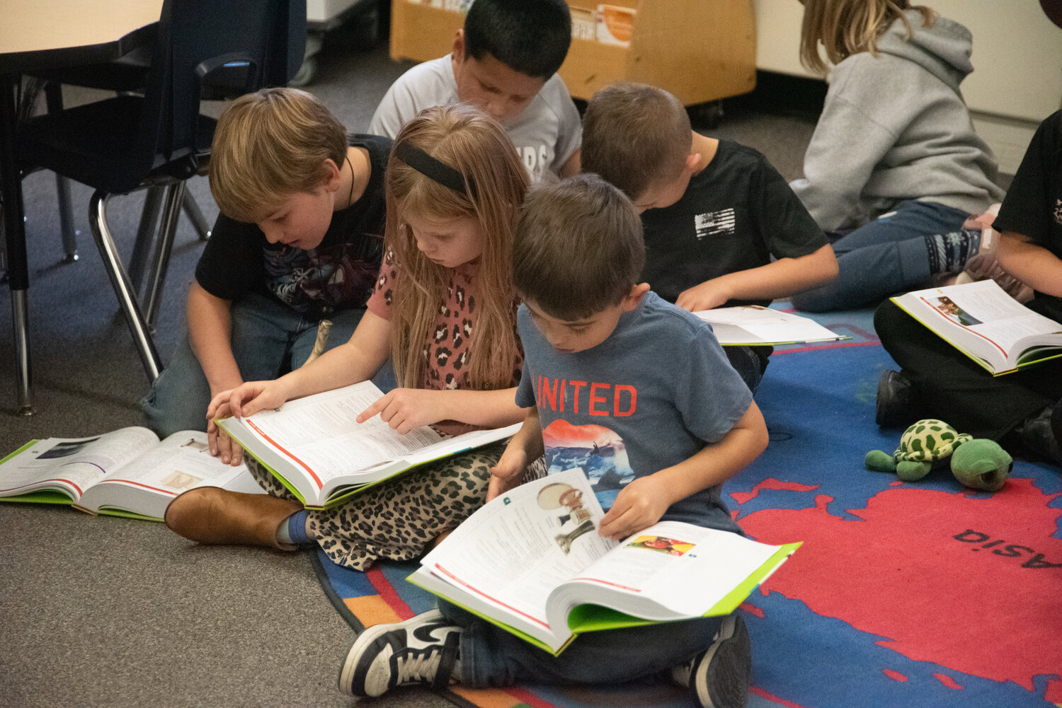 Local Rotarians hand out more than 100 dictionaries to Pagosa Springs Elementary School third-graders and dive into the new books together. Rotarians encouraged the children to look up various words and to explore other sections of the book, such as state and country flags, maps and presidents.