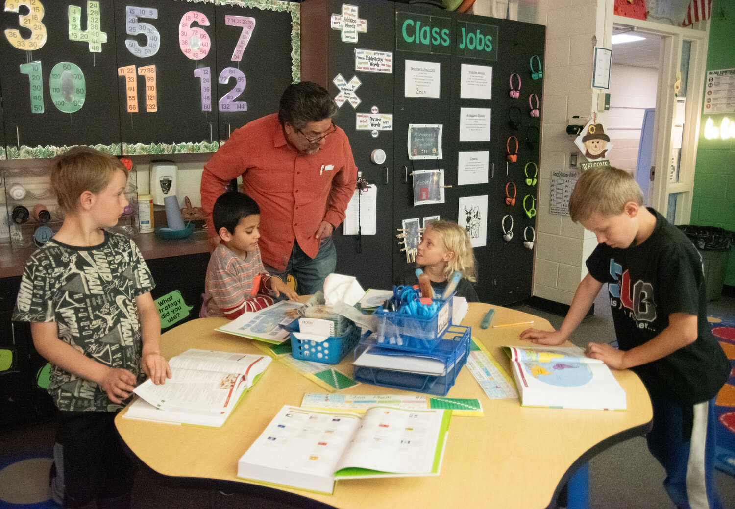 Local Rotarians hand out more than 100 dictionaries to Pagosa Springs Elementary School third-graders and dive into the new books together. Rotarians encouraged the children to look up various words and to explore other sections of the book, such as state and country flags, maps and presidents.