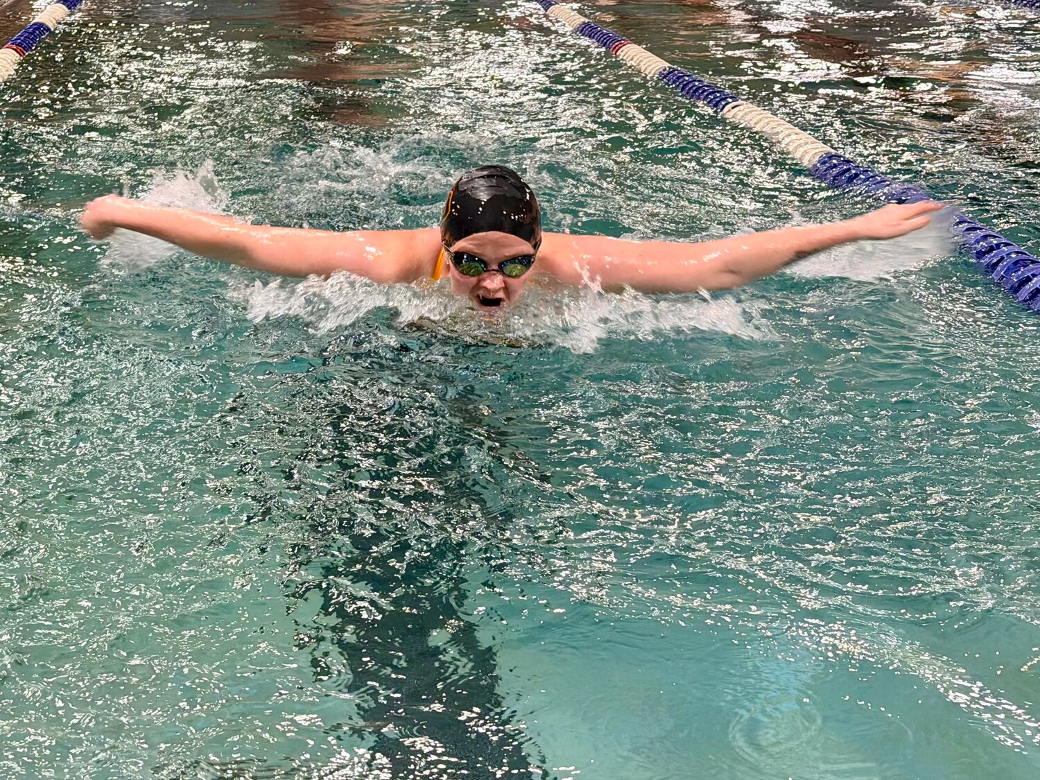 Lady Pirate Asia Gorman takes to the water in Delta on Friday, Dec. 12. Gorman and her fellow 200-meter medley relay team members &mdash; Marlowe Hedgecock, Leah Blackman and Chloe Gantt &mdash; qualified for state with a time of two minutes and 19.51 seconds.