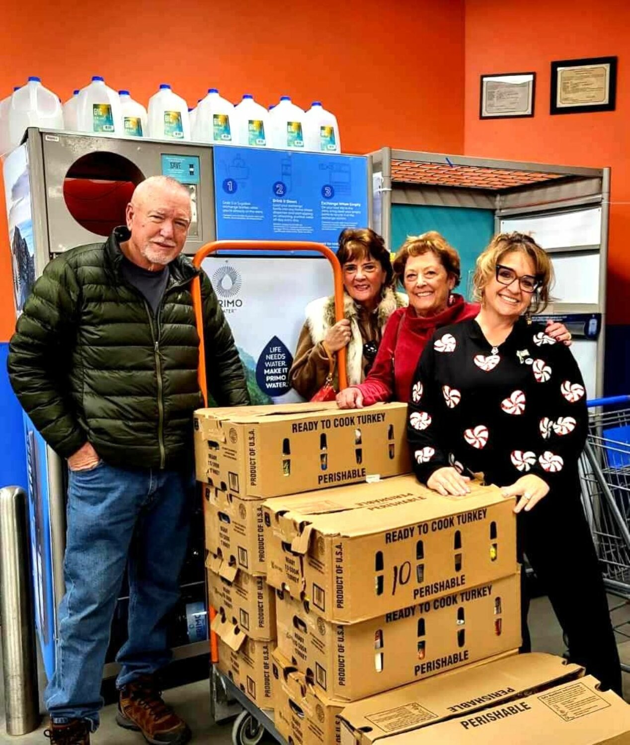 Ten families in Pagosa Springs received a Christmas meal box donated by the Republicans of Archuleta County. The box contained a complete meal with a turkey and all of the trimmings, including a pumpkin pie. Helping to box and distribute are, left to right, Brad Hunt, coroner; Michele Turney, Archuleta County Republican Women (ACRW) secretary; Melinda Ratliff, treasurer of ACRW and Archuleta County Republican Central Committee; and Veronica Medina, county commissioner.