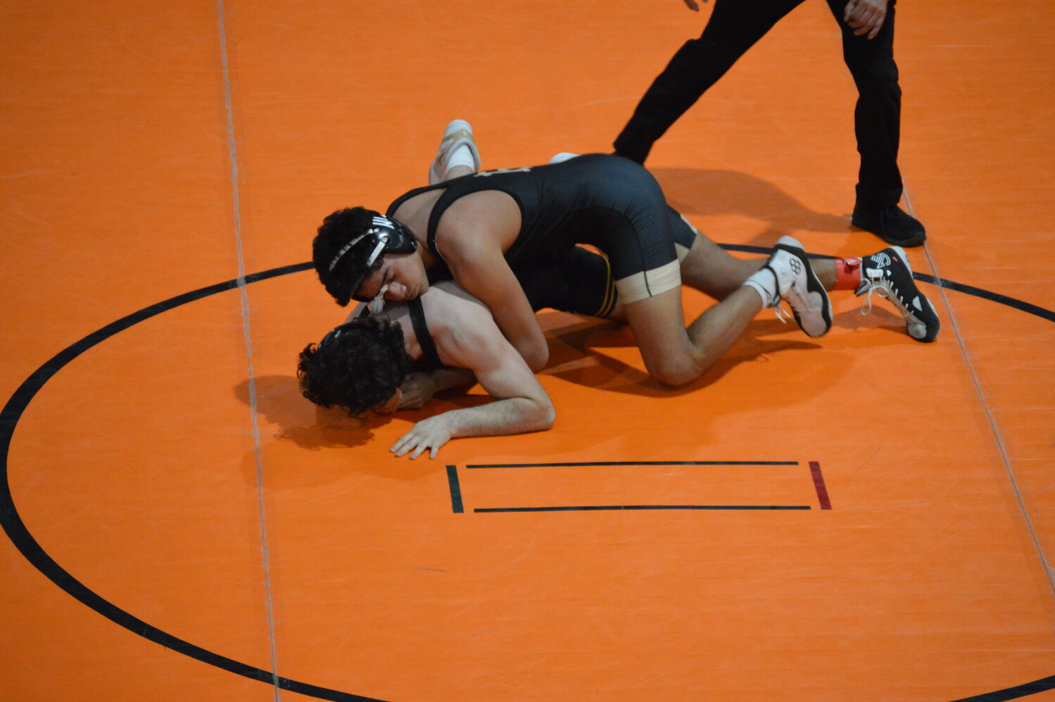 Pirate Devon Gonzalez works to maintain control over an opponent at the Clash at the Coliseum on Saturday, Jan. 17, in Aztec, N.M. Gonzalez won seven matches at the tournament.