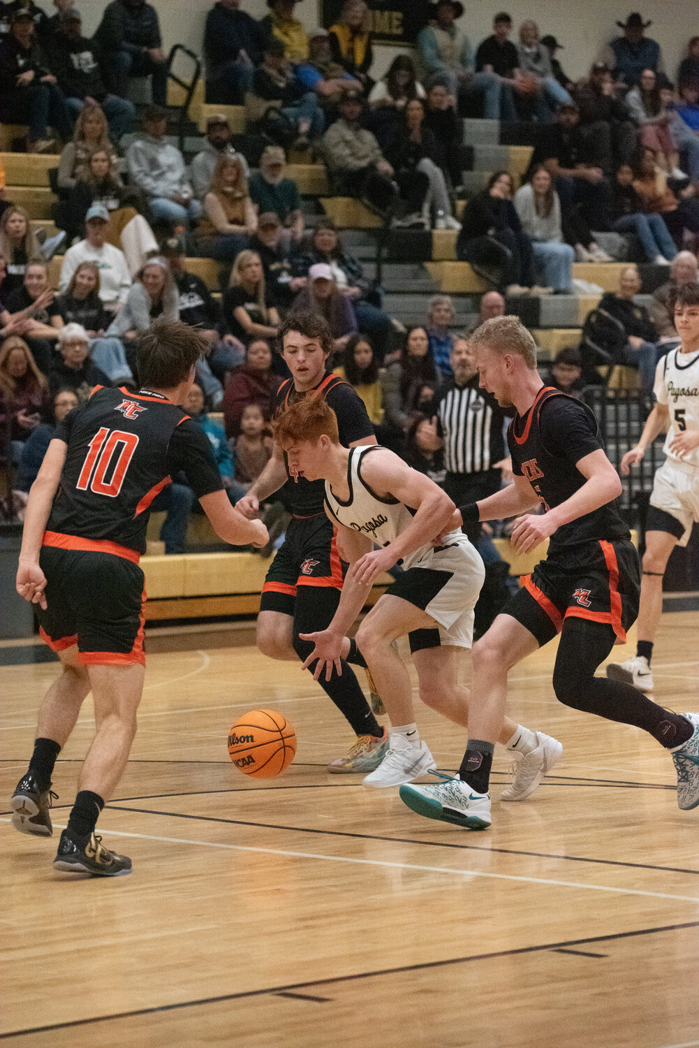 Pirate Jerry Dean maneuvers through a trio of Montezuma-Cortez Panther defenders on Saturday, Jan. 24. Despite being down by six going into the fourth quarter, the Pirates fell 76-48 to the undefeated Panthers.