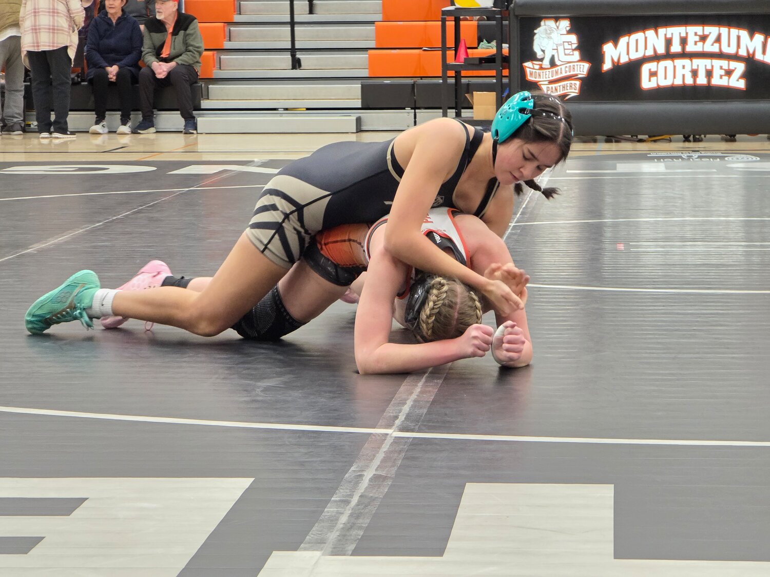 Lady Pirate Audrina Smith works to take control of her opponent during the team&rsquo;s dual against the Montezuma-Cortez Panthers. Smith pinned her opponent after 1:26 at 135 pounds.